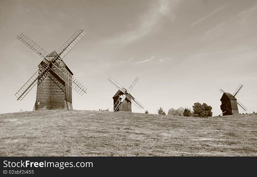 Group of antique trestle type Windmills (from 19th century) in sepia