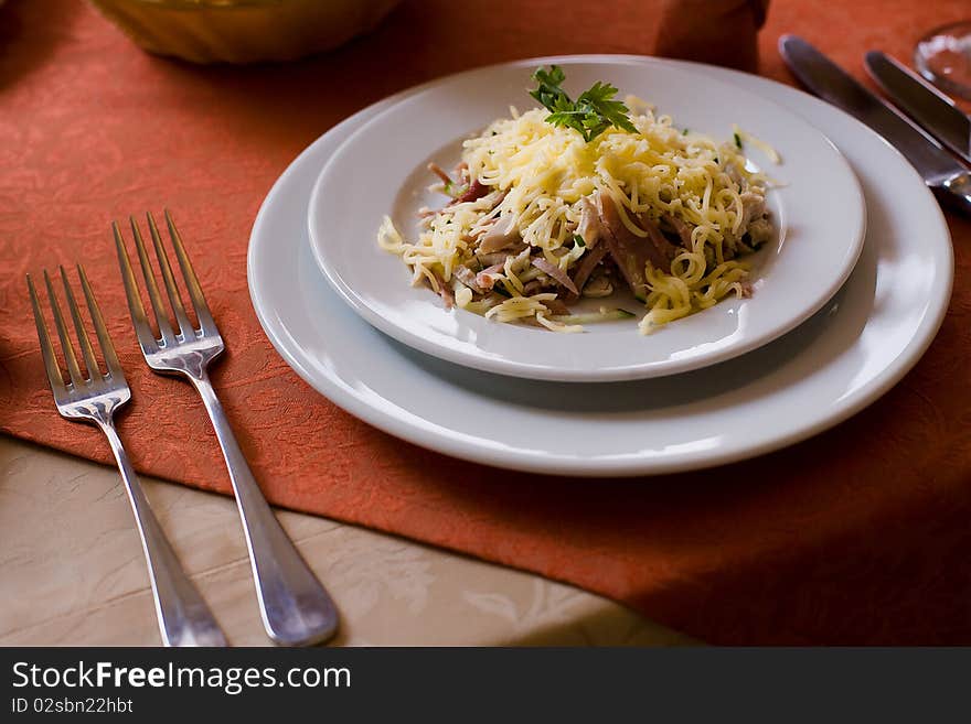 Dish with cheese, greens and meat. Dish with cheese, greens and meat