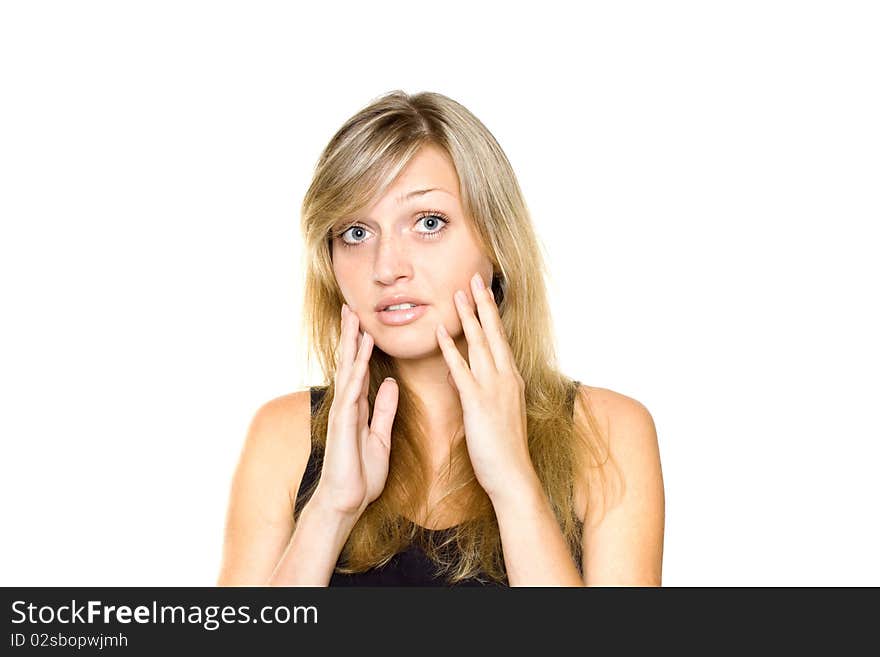 Close-up of a young woman looking surprised on white background