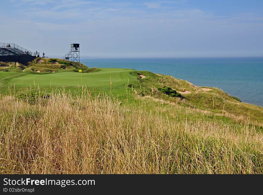 A green set up for a tournament with severe surrounds and water. A green set up for a tournament with severe surrounds and water