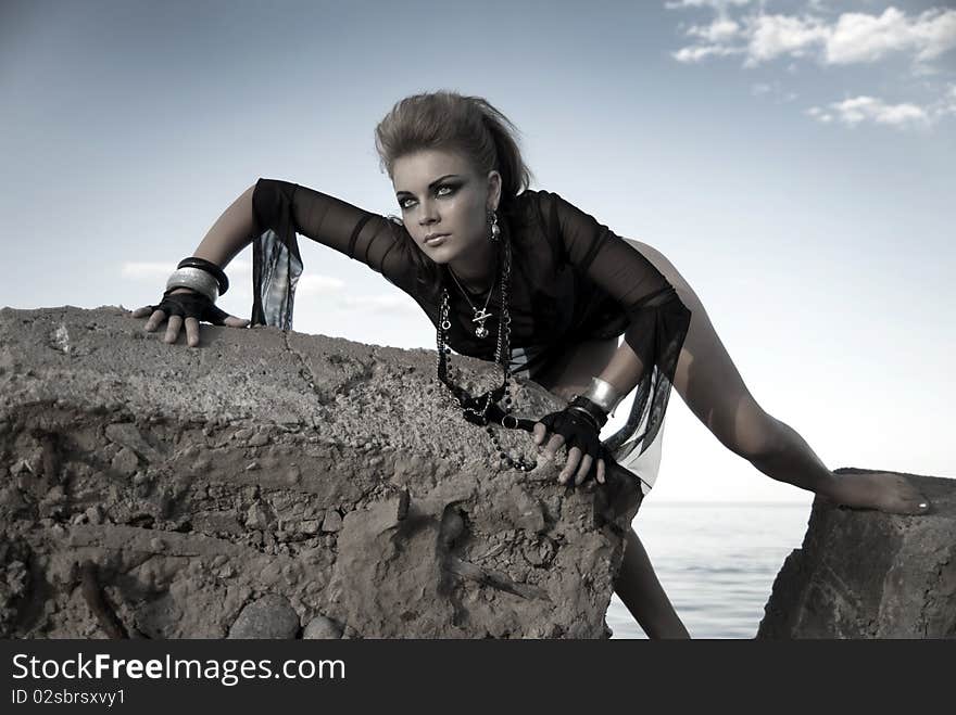 Rock Girl On A Concrete Slab