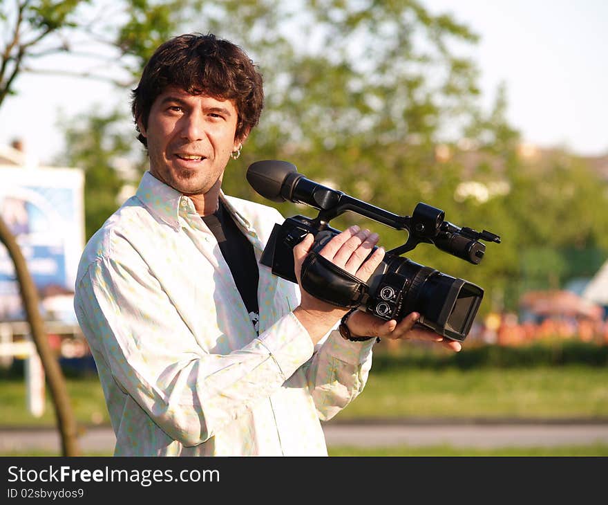 Photographer holding digital camera