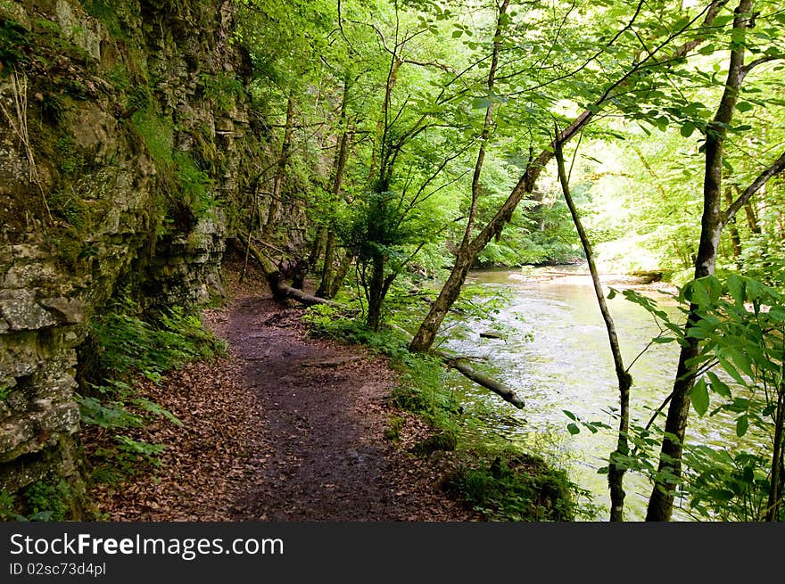 Hiking trail in the Black Forest between rocks and river. Hiking trail in the Black Forest between rocks and river