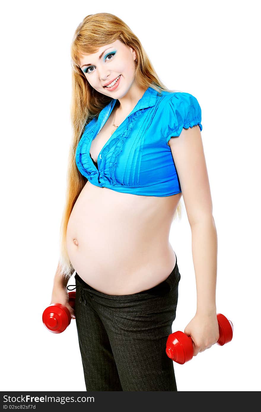 Portrait of pregnant woman training with dumbbells. Isolated over white background. Portrait of pregnant woman training with dumbbells. Isolated over white background.