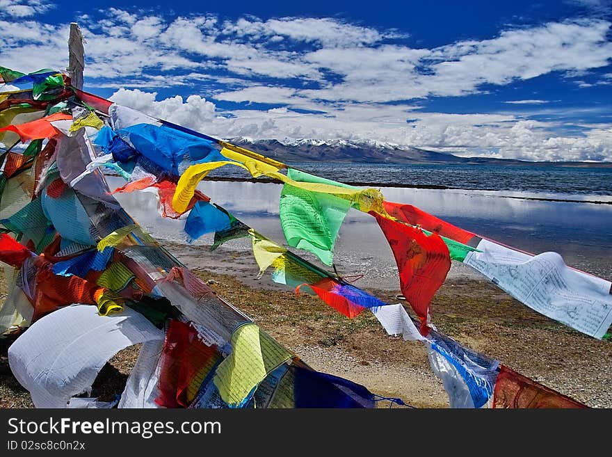 Scripture flag near the Mapam Yumco lakeã€‚The Mapam Yumco lake is one of tibet's holy lake.It is the biggest holy lake in tibet. Scripture flag near the Mapam Yumco lakeã€‚The Mapam Yumco lake is one of tibet's holy lake.It is the biggest holy lake in tibet.