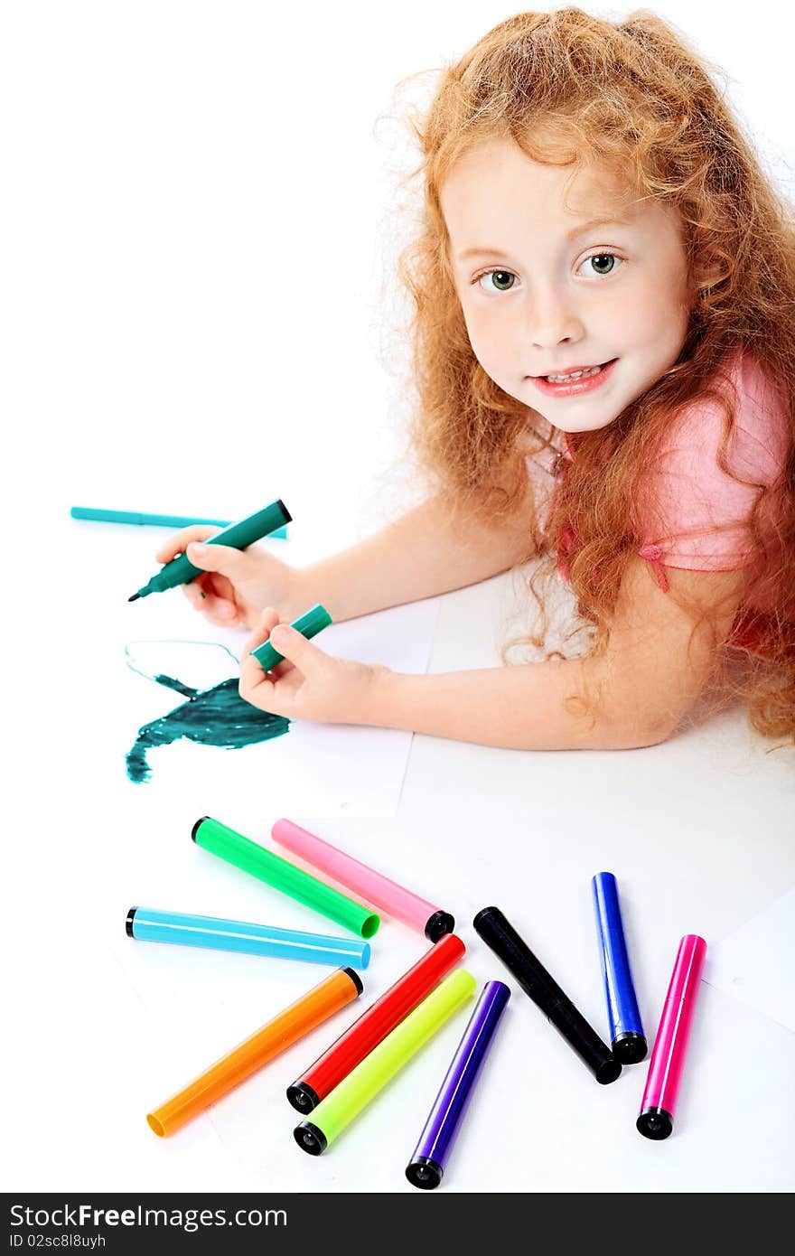 Portrait of a happy girl with felt pens. Isolated over white background. Portrait of a happy girl with felt pens. Isolated over white background.