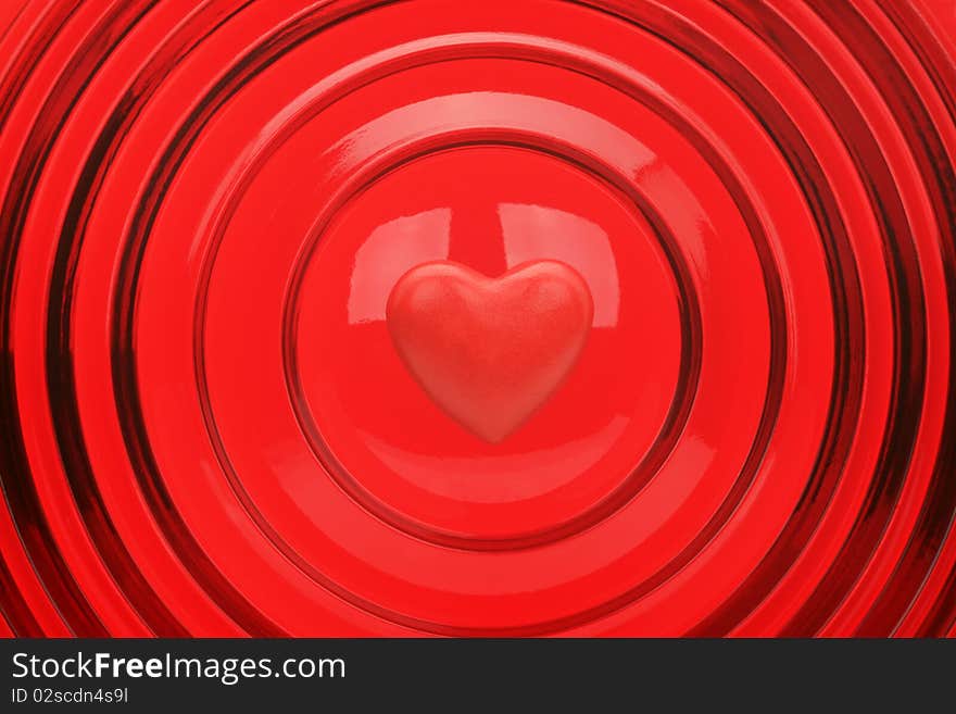 Heart on a red background with concentric circles