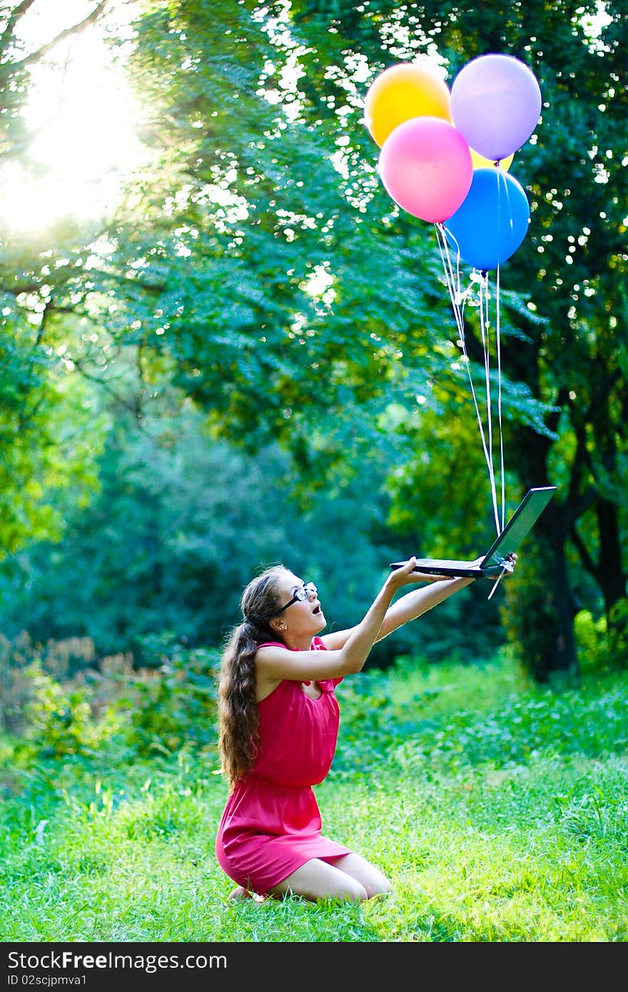 Girl with notebook and balls