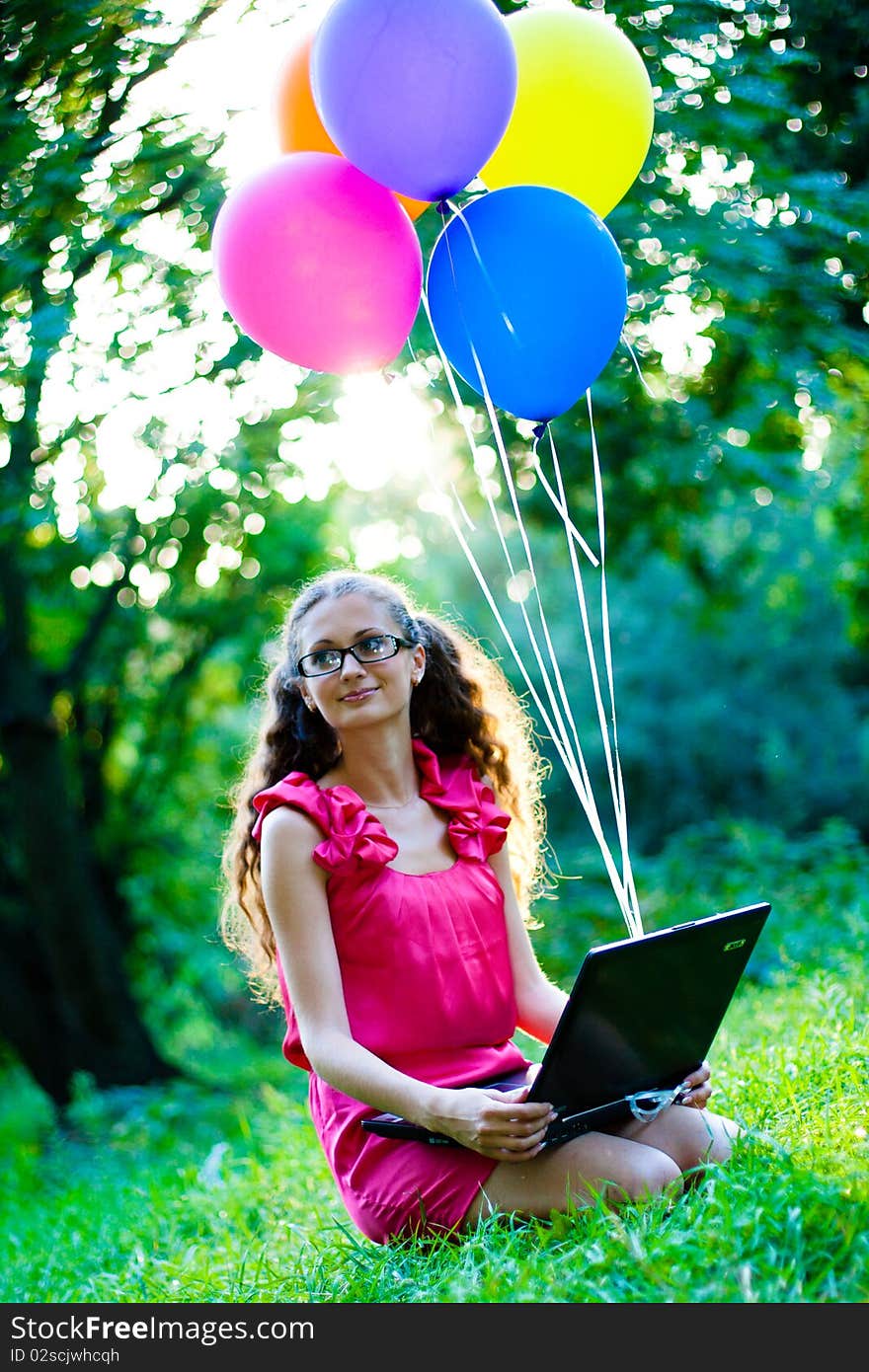 Girl with notebook and balls