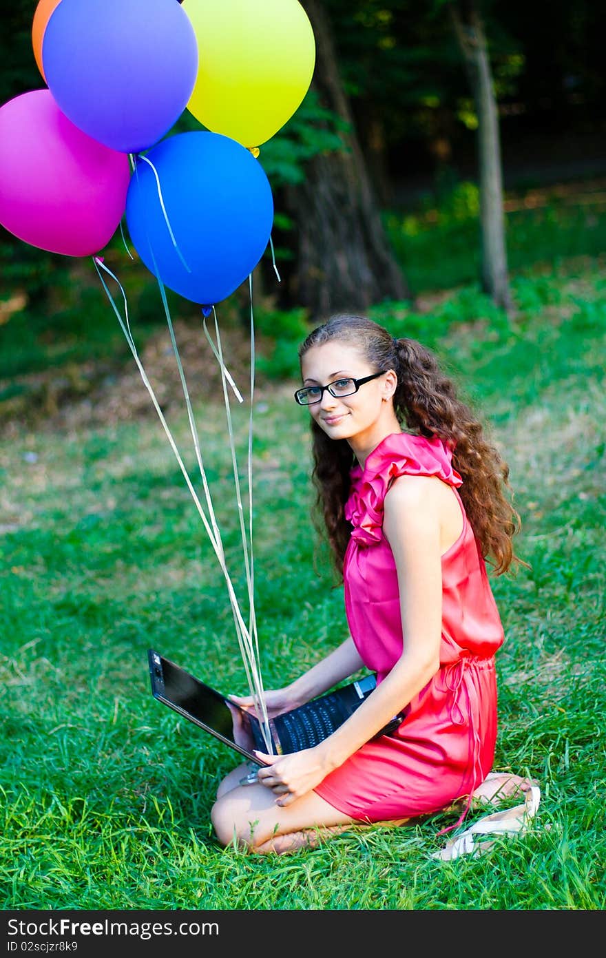 Girl with notebook and balls