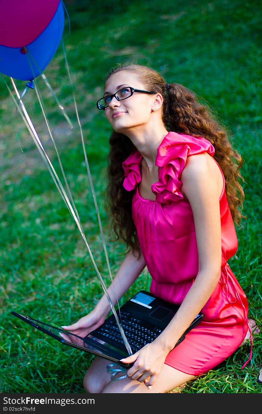 Girl with notebook and balls