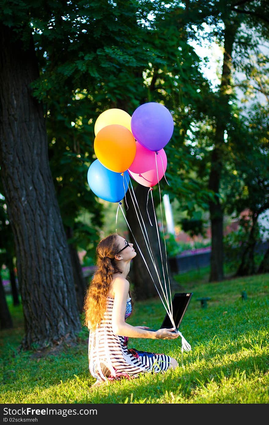 Girl with notebook and balls