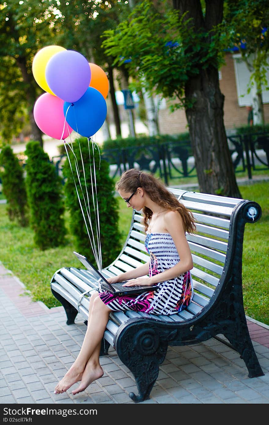 Girl with notebook and balls