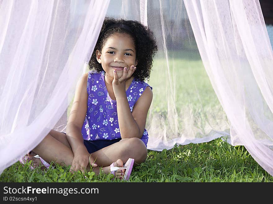 Girl Sitting In Her Canopy