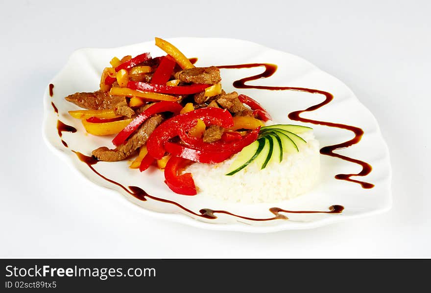 Grilled meat with paprica and rice garnish