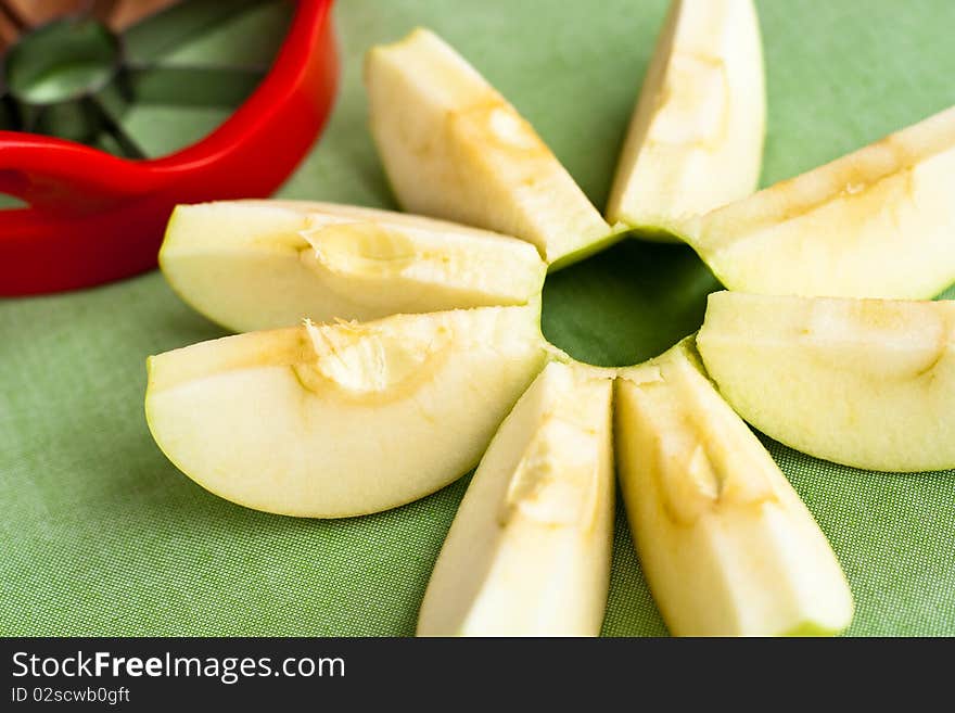 Cut apple in shape of flower and a red corer