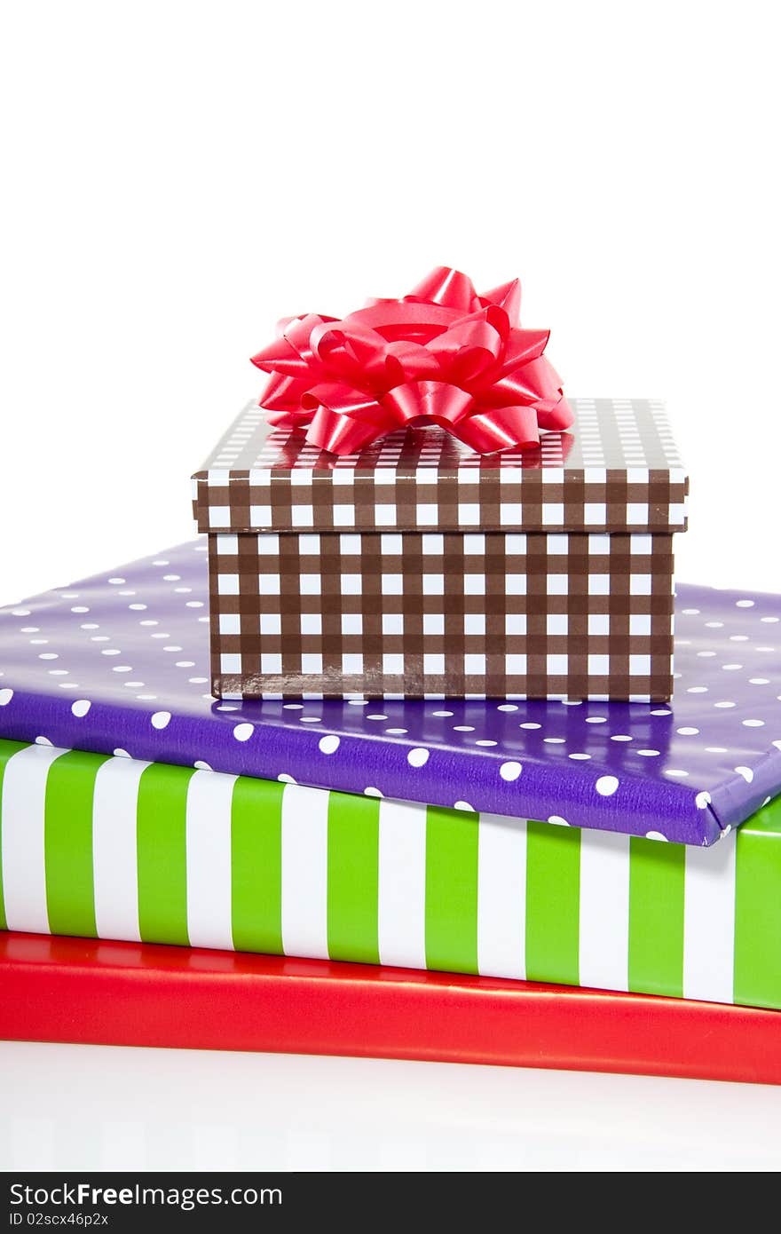 A stack of colorful gifts isolated over white. A stack of colorful gifts isolated over white