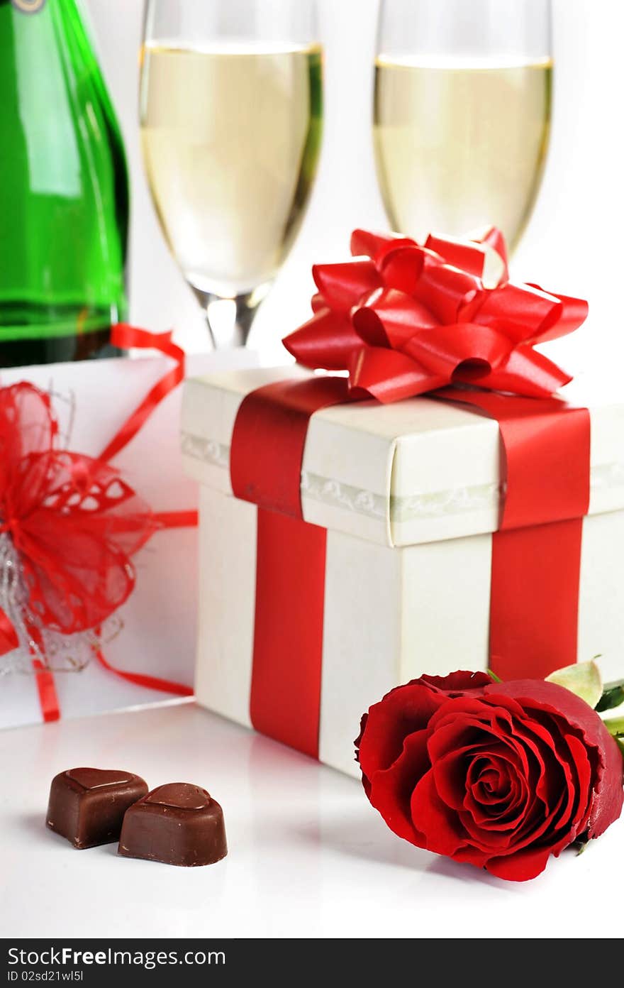 Beautiful red rose, champagne and chocolate close up. Beautiful red rose, champagne and chocolate close up