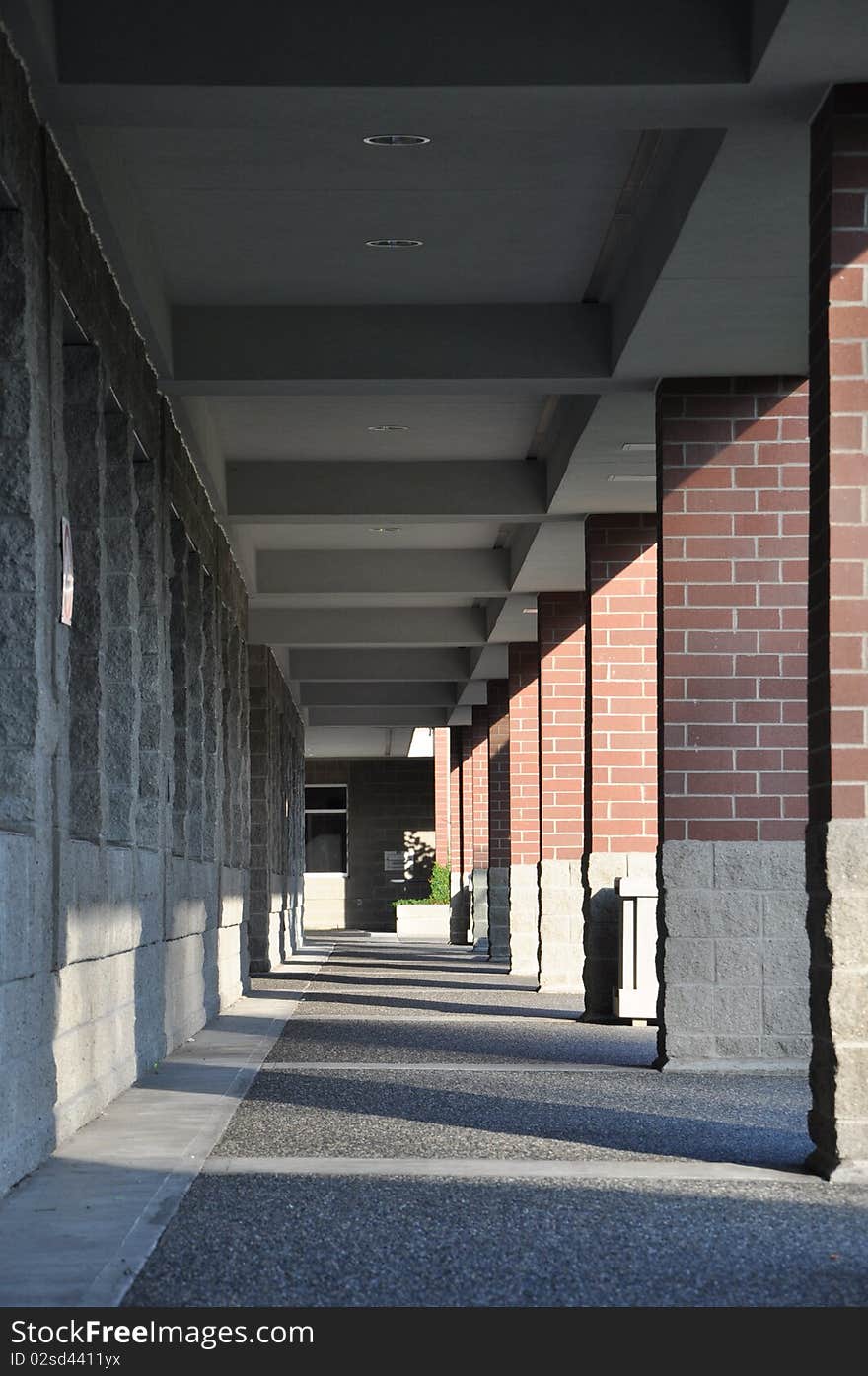 Columned hallway with sun shadows