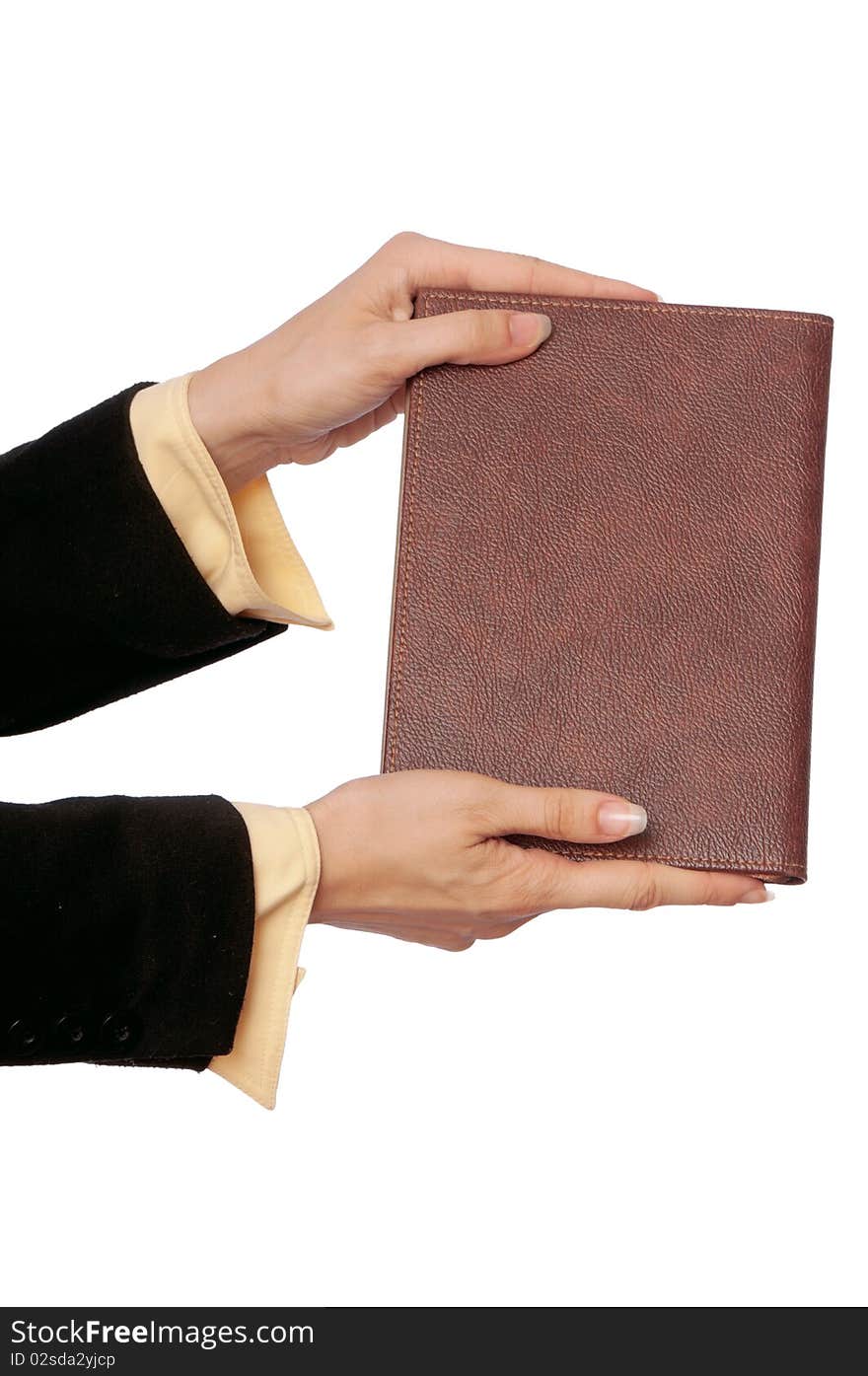 The woman holds the business book for notes