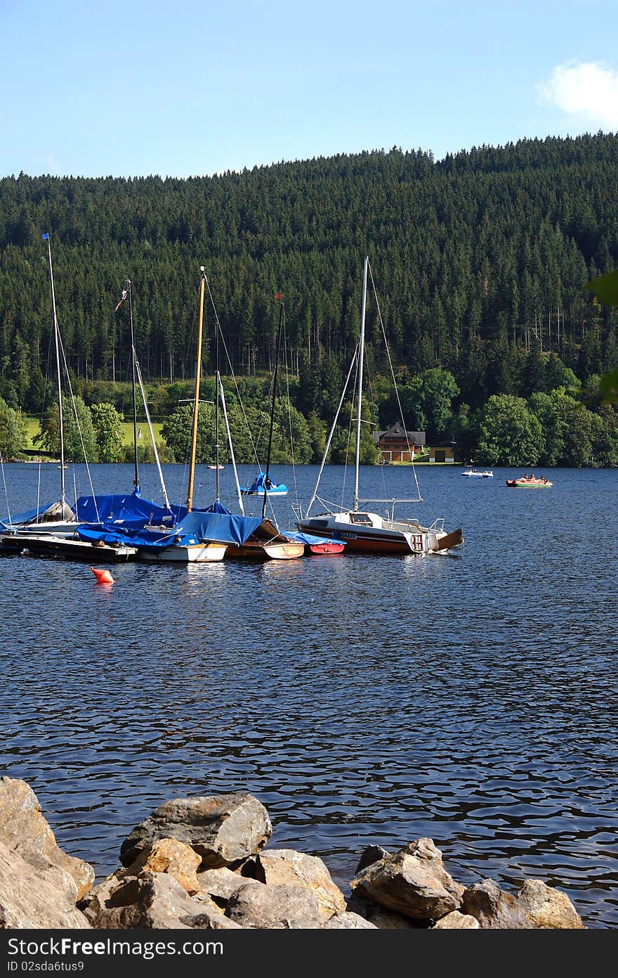 Yachts on coast of lake