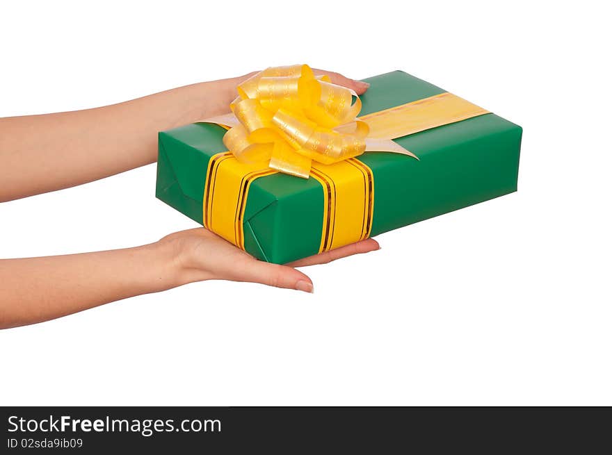 Woman giving a green box with yellow ribbon as a gift