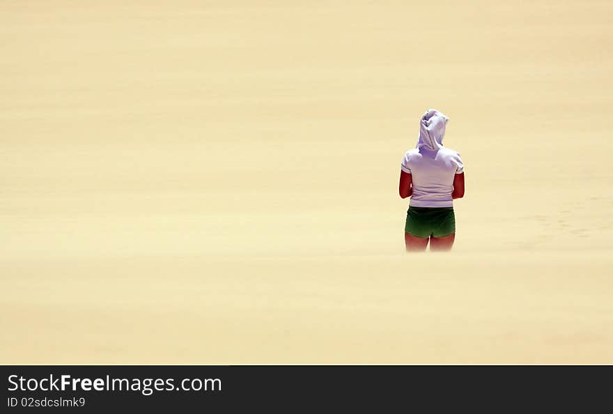 Girl looking over the endless sea of sand. Girl looking over the endless sea of sand