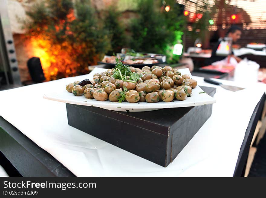 Served green olives in a restaurant