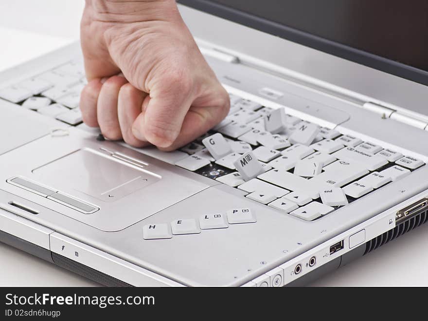 By hand damaged laptop on white background with help word. By hand damaged laptop on white background with help word