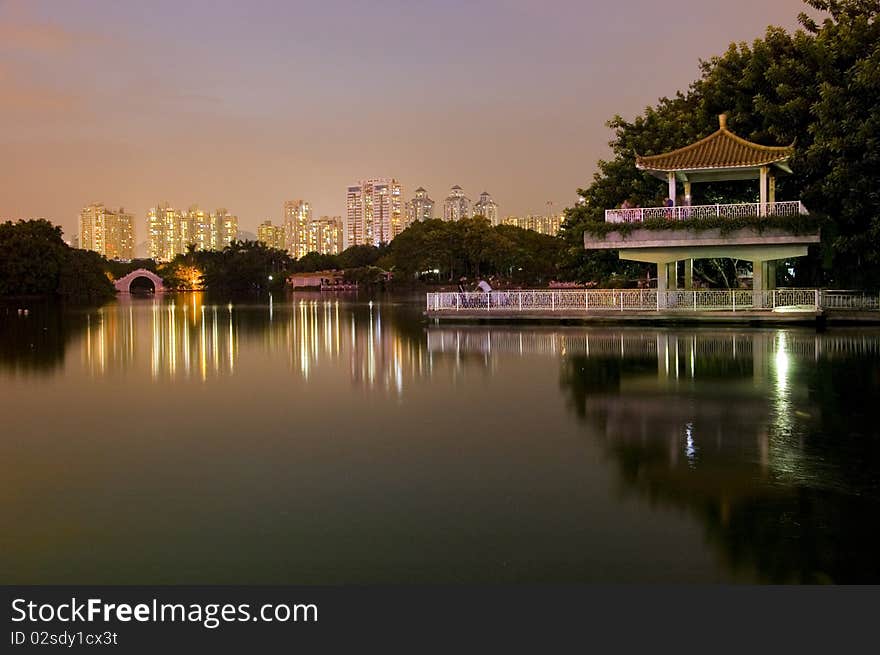 Leeche Park in Shenzhen city by night. Evening landscape with beautiful lake and Chinese pavilion. Leeche Park in Shenzhen city by night. Evening landscape with beautiful lake and Chinese pavilion.