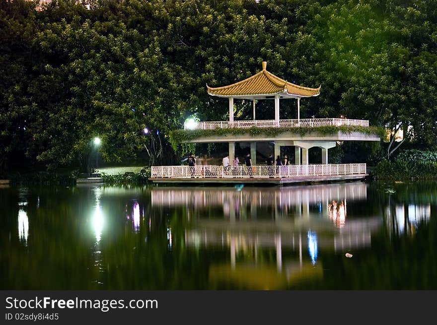 Leeche Park in Shenzhen city by night. Evening landscape with beautiful lake and Chinese pavilion. Leeche Park in Shenzhen city by night. Evening landscape with beautiful lake and Chinese pavilion.