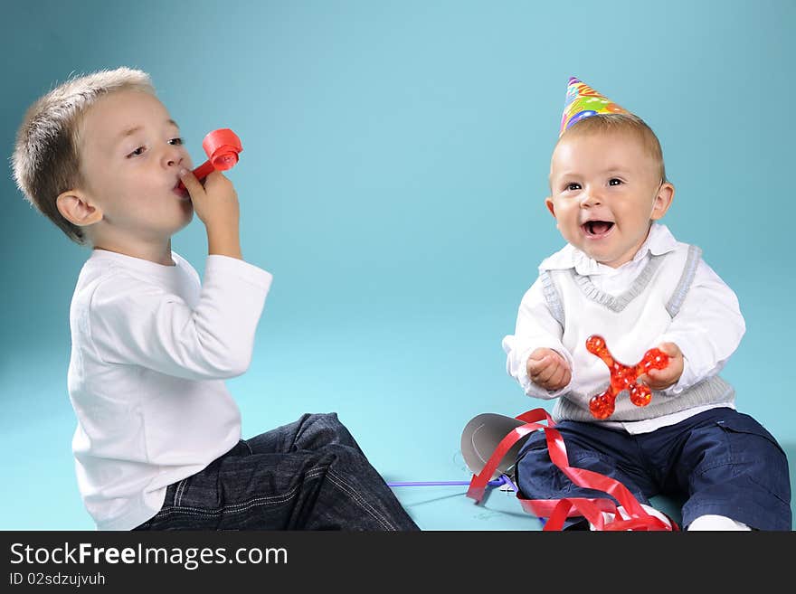 Beautiful caucasian kids playing with toys in studio. Beautiful caucasian kids playing with toys in studio