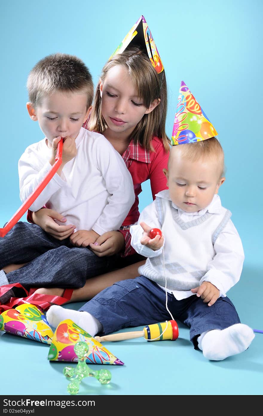 White girl playing with two beautiful boys