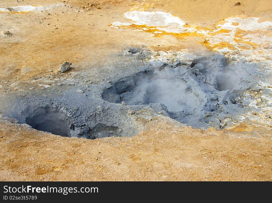 Geothermal area in Iceland. Colorful Sulphur on the ground.