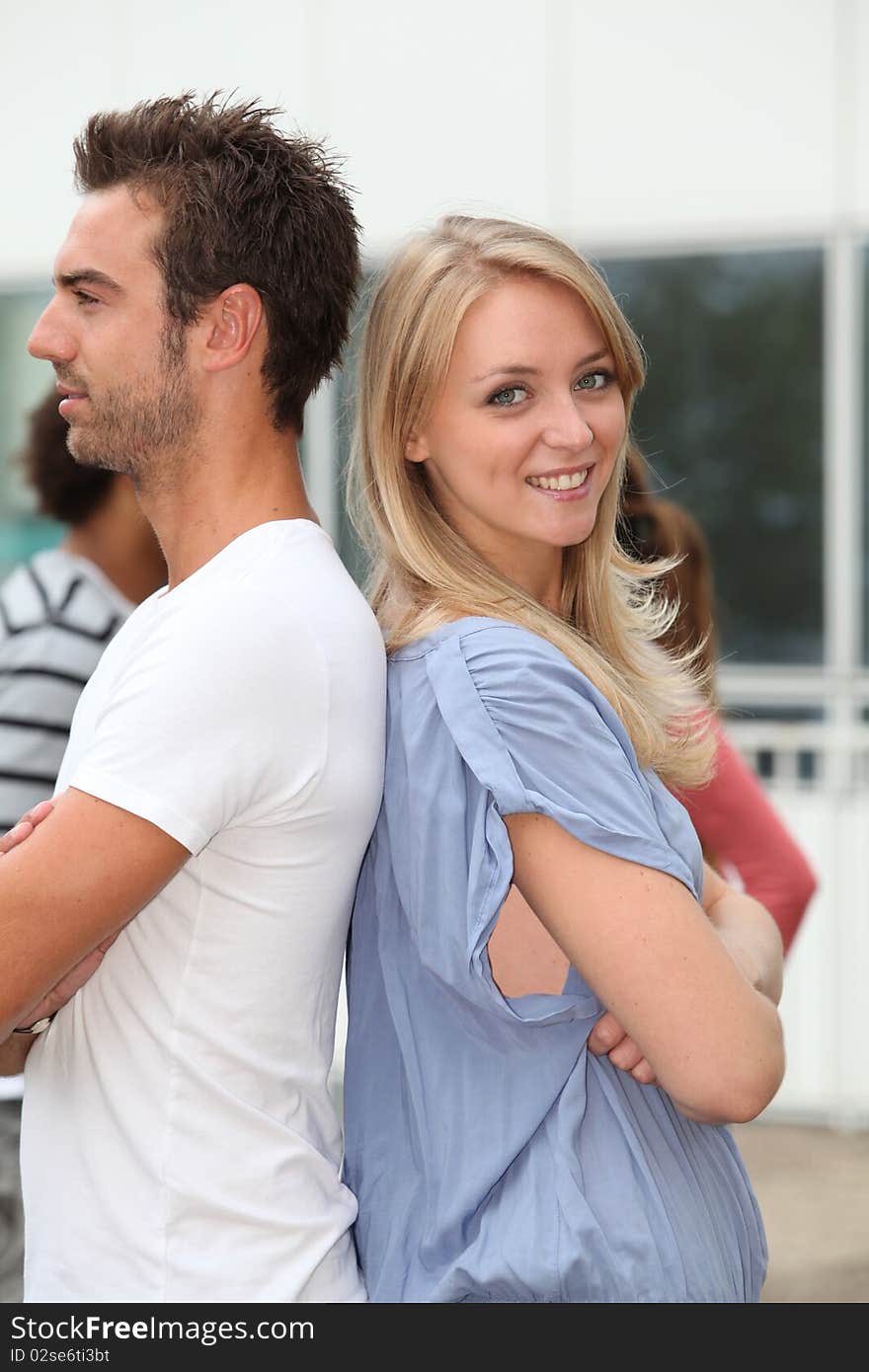 Closeup young man and young blond woman. Closeup young man and young blond woman