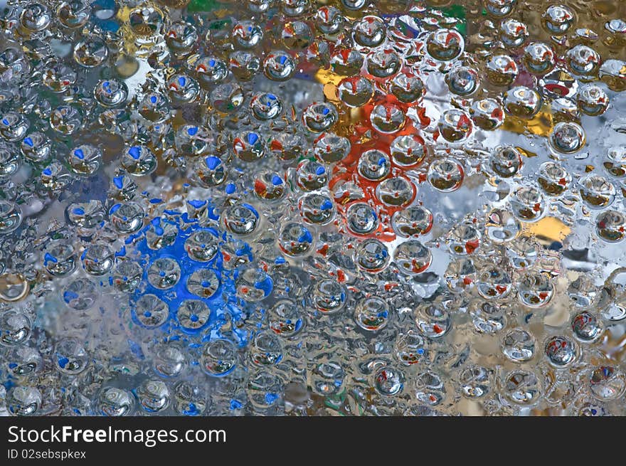 Abstract Colored On Glass Surface Macro.