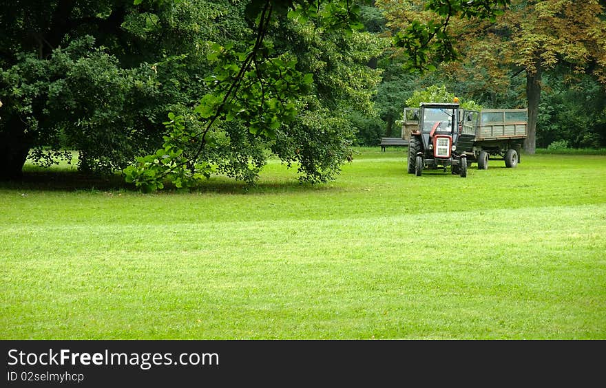 Tractor standing in the park. Tractor standing in the park