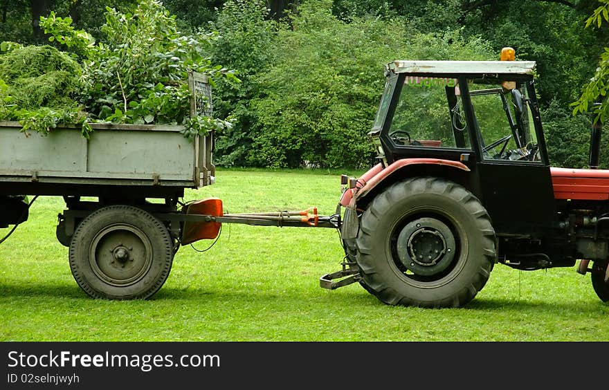 Tractor standing in the park. Tractor standing in the park