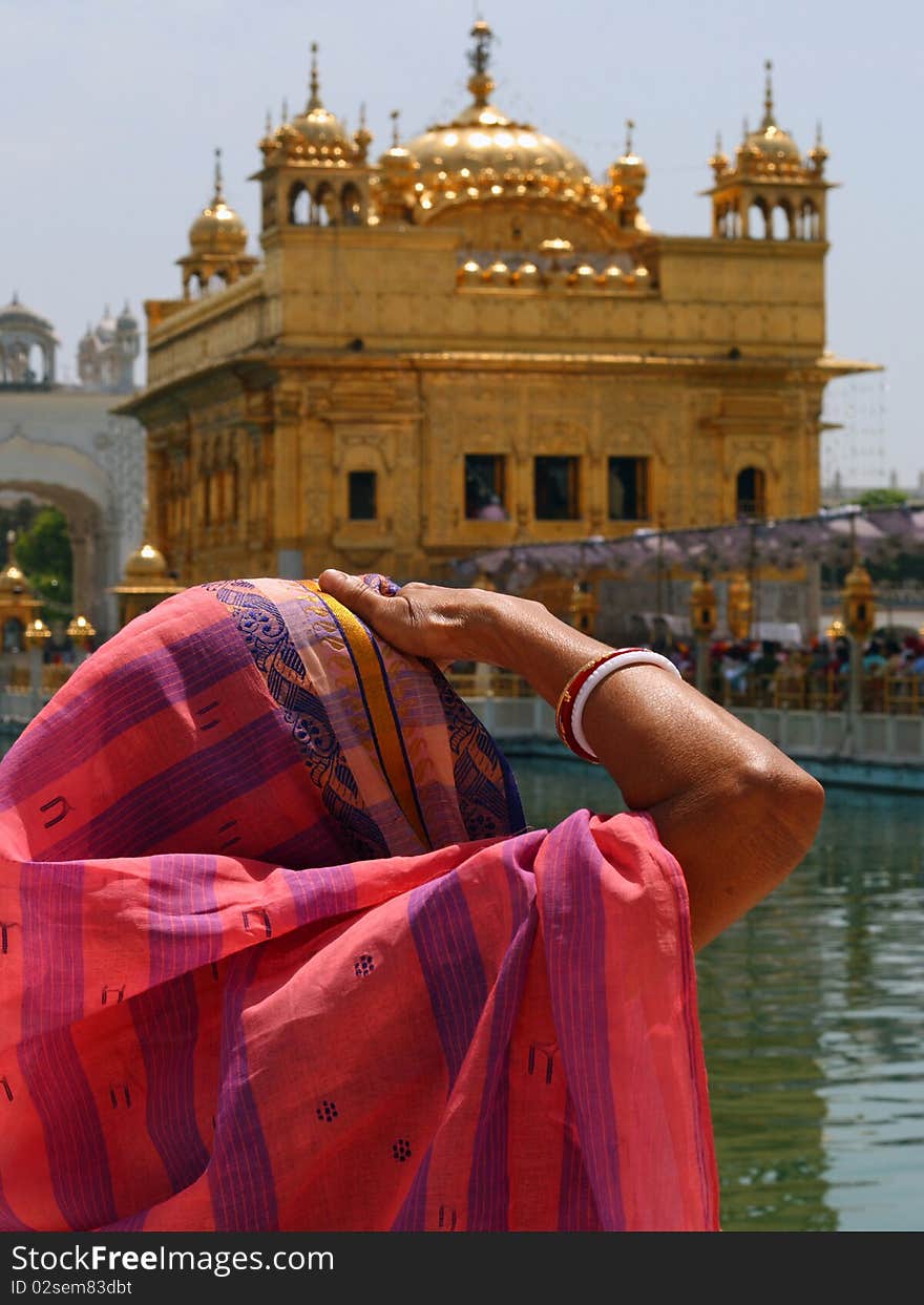 Lady/woman looking at Golden Temple, Amritsar, Punjab, India. Lady/woman looking at Golden Temple, Amritsar, Punjab, India