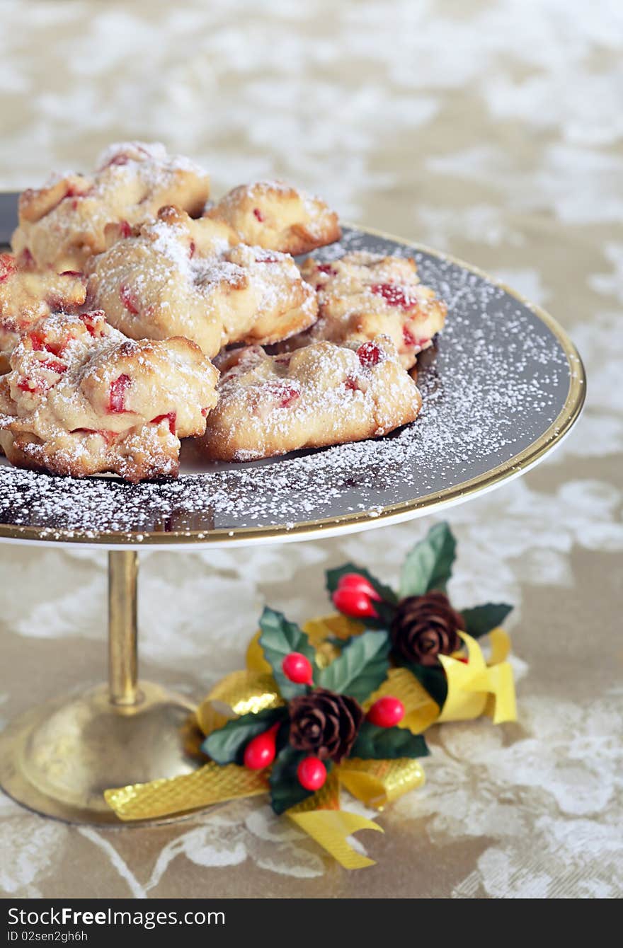 Light as air shortbread dessert baked with candied cherries and dusted with icing sugar. Light as air shortbread dessert baked with candied cherries and dusted with icing sugar