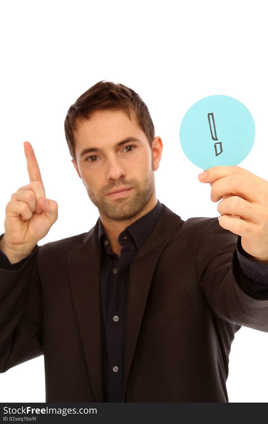 Young man holding a plate with a Exclamation points