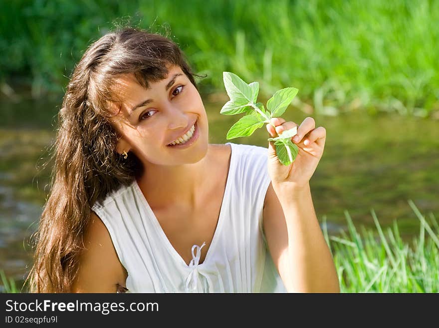 Smiling happy girl with mint