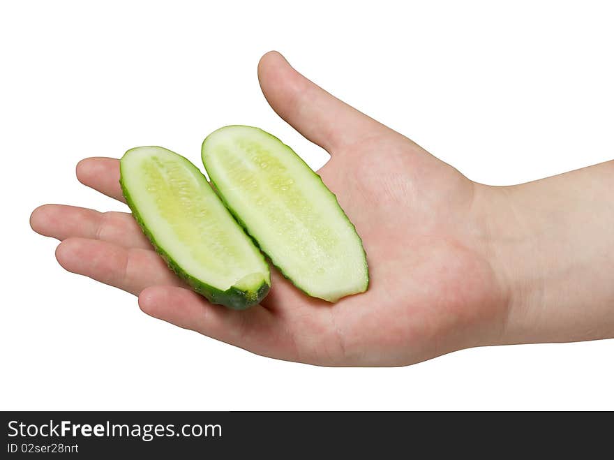 Sliced cucumber in human hand