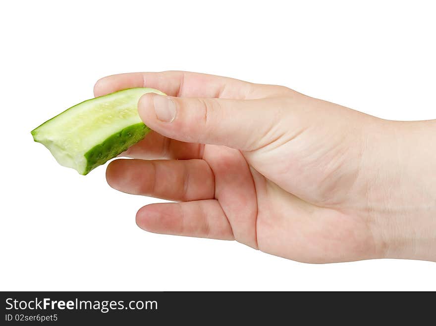 Sliced cucumber in human hand