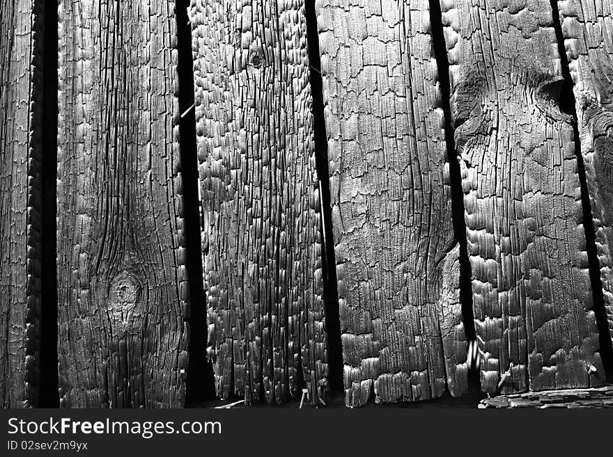 Burnt wooden planks in close up - background. Burnt wooden planks in close up - background