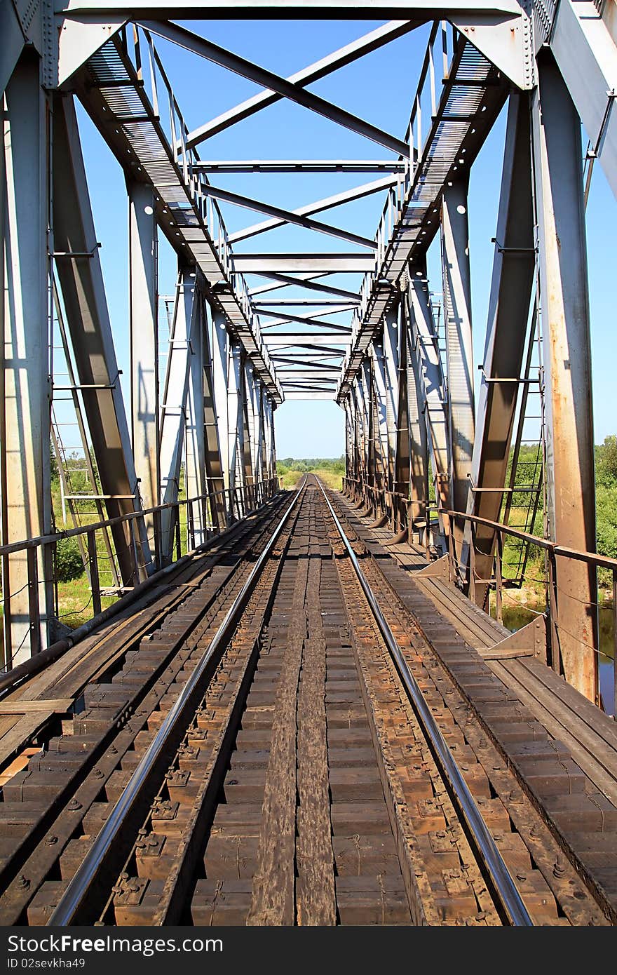 Railway bridge through small river