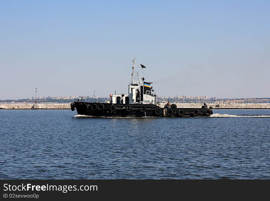 Image moving tugboat at water area