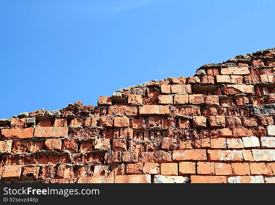 Aging brick wall on celestial background