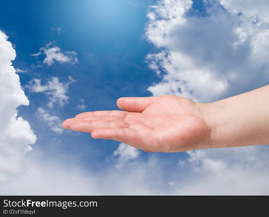 Man hand on blue sky