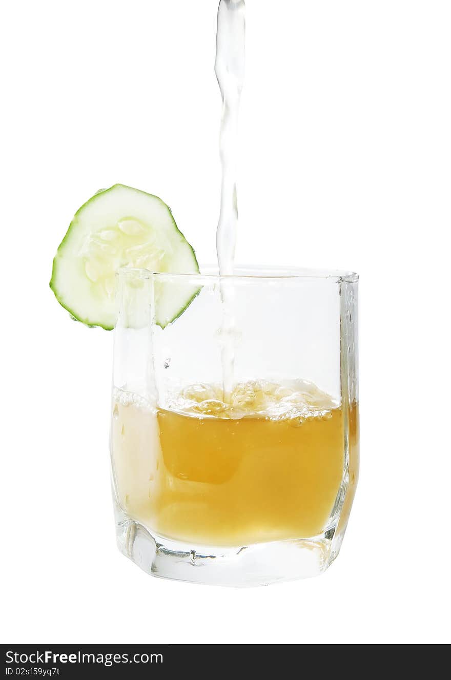 Brine with cucumber in glass isolated